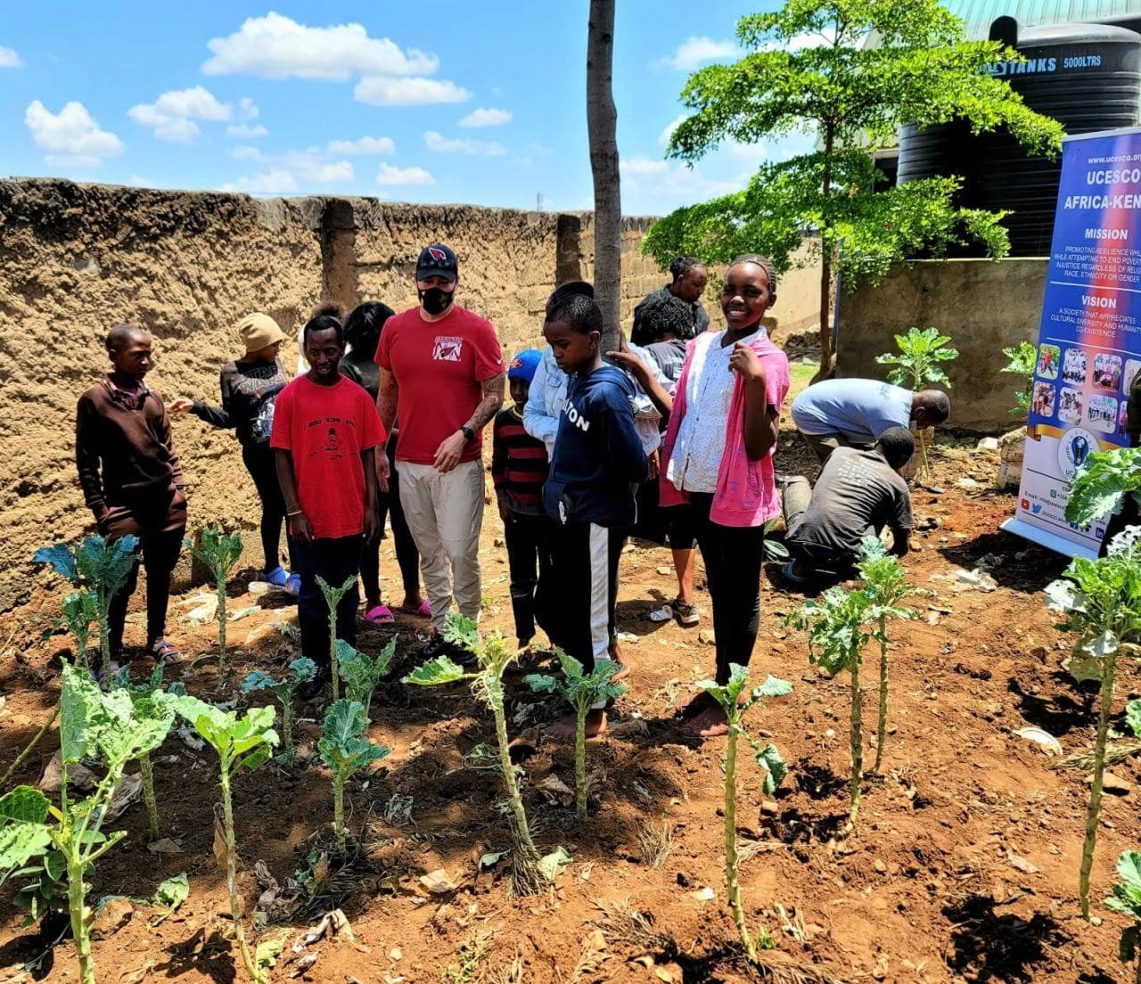 Children farming with sponsor