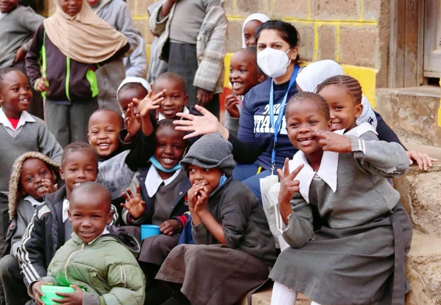 Children sitting with sponsor