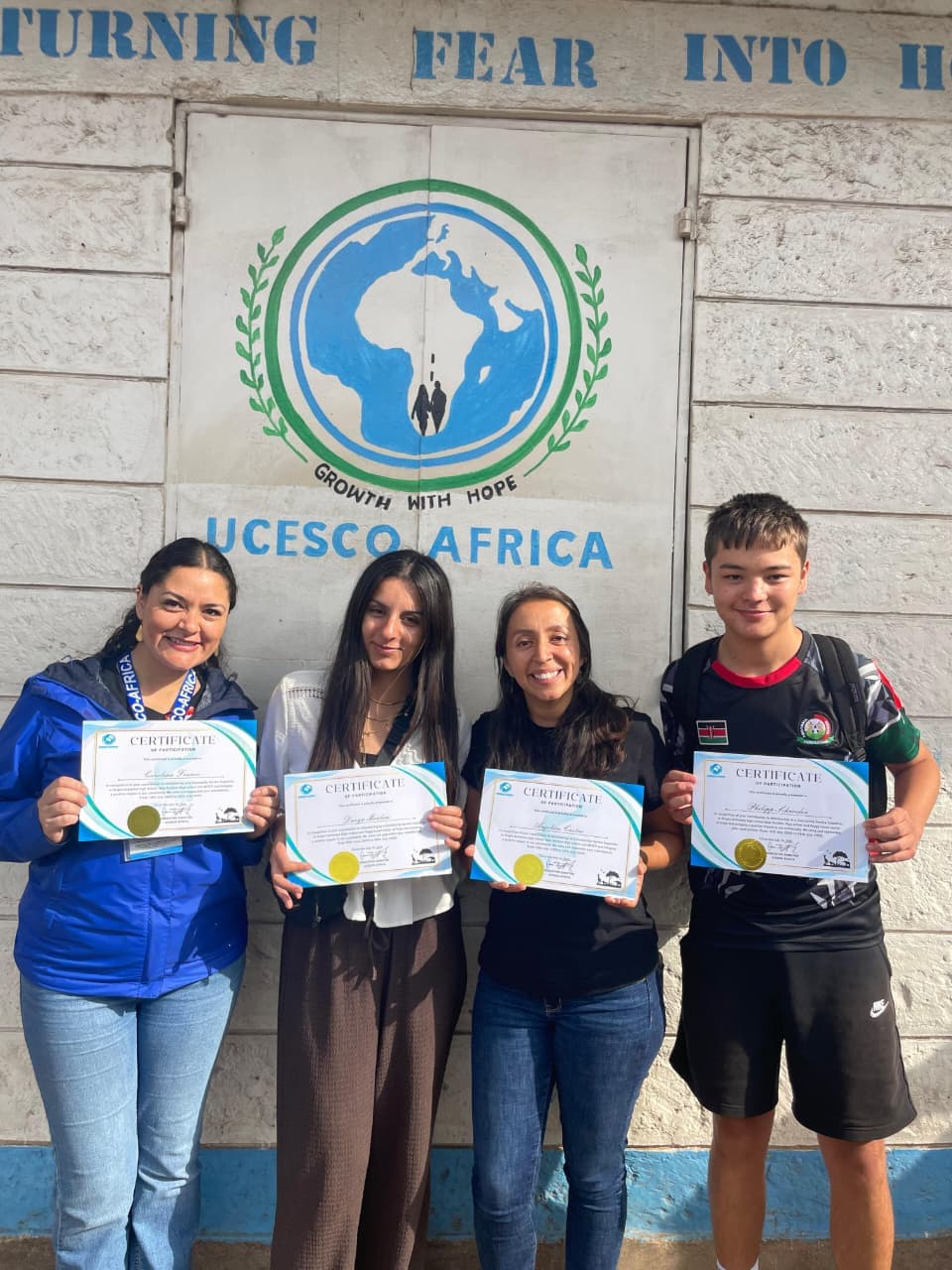 UCESCO staff with branding